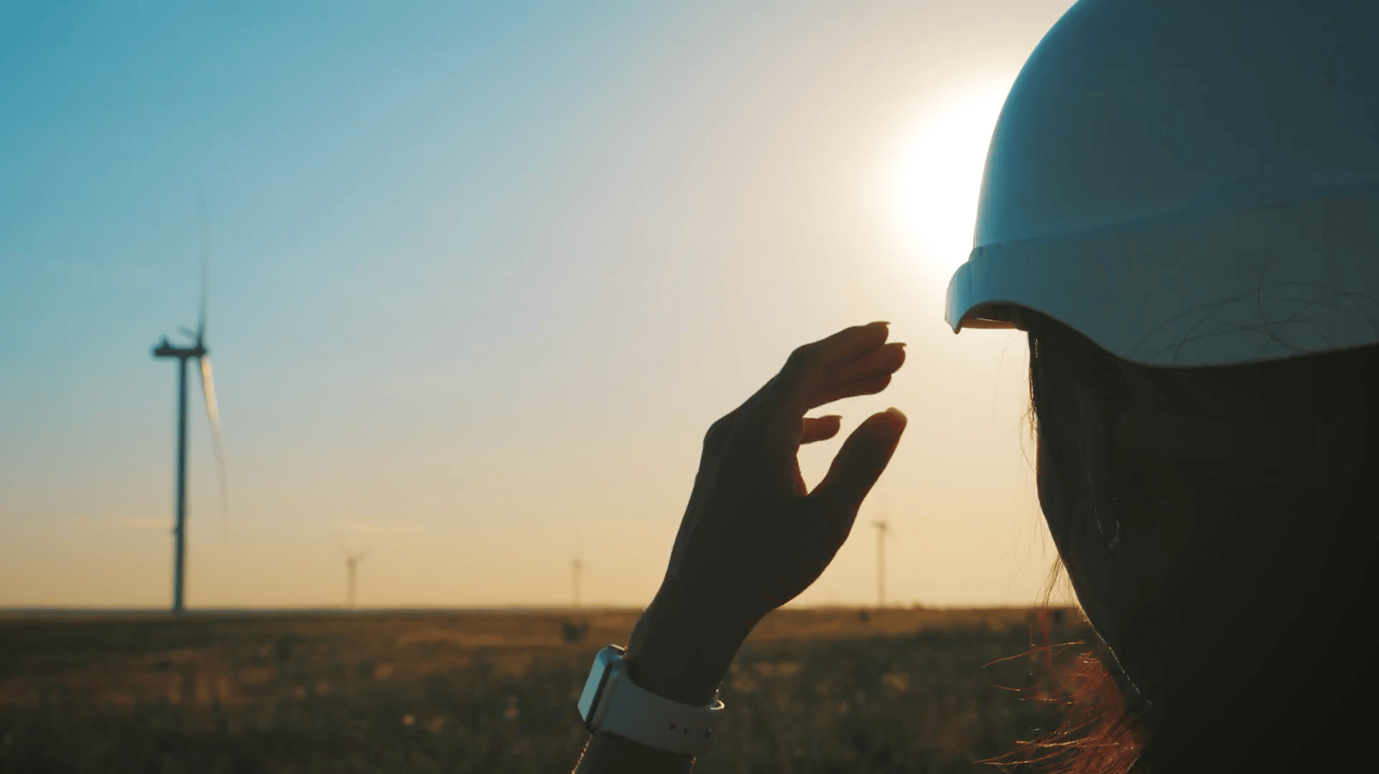 woman-engineer-working-in-wind-turbine-electricity-industrial-at-sunset woman-engineer-working-in-wind-turbine-electricity-industrial-at-sunset